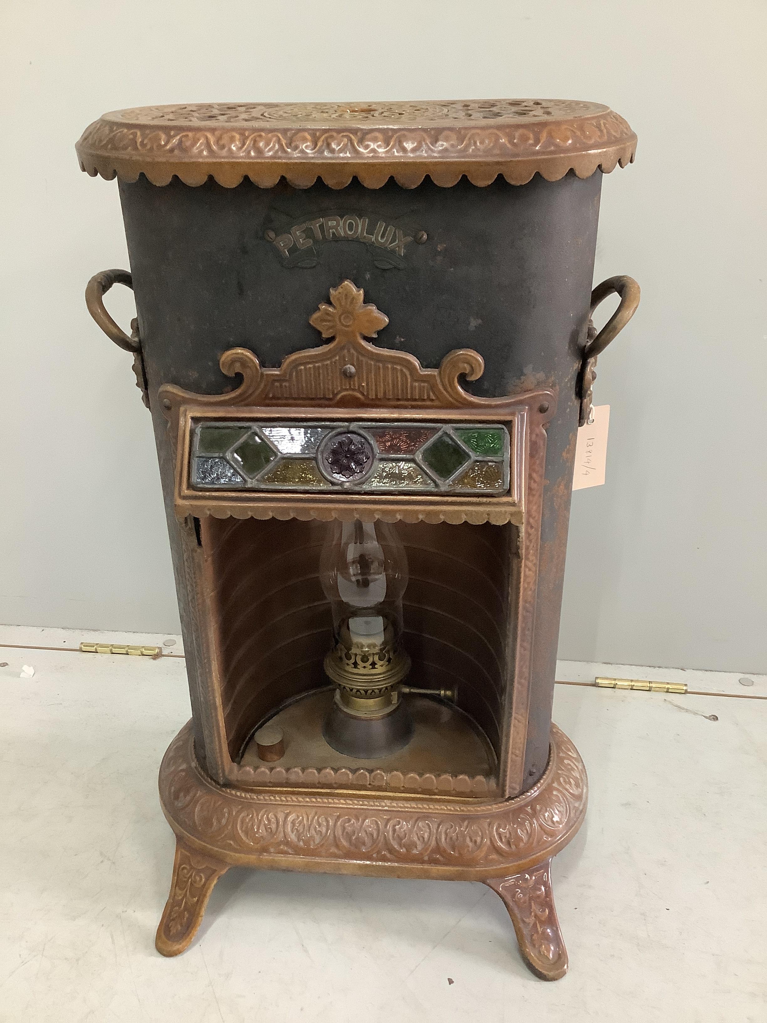 An early 20th century Petrolux cast iron heater, height 68cm